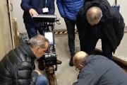 Specialists are studying a rail sample testing results with the ultrasonic flaw detector UDS2-77 in the process of on-site training, Italian company's office, Fall 2019